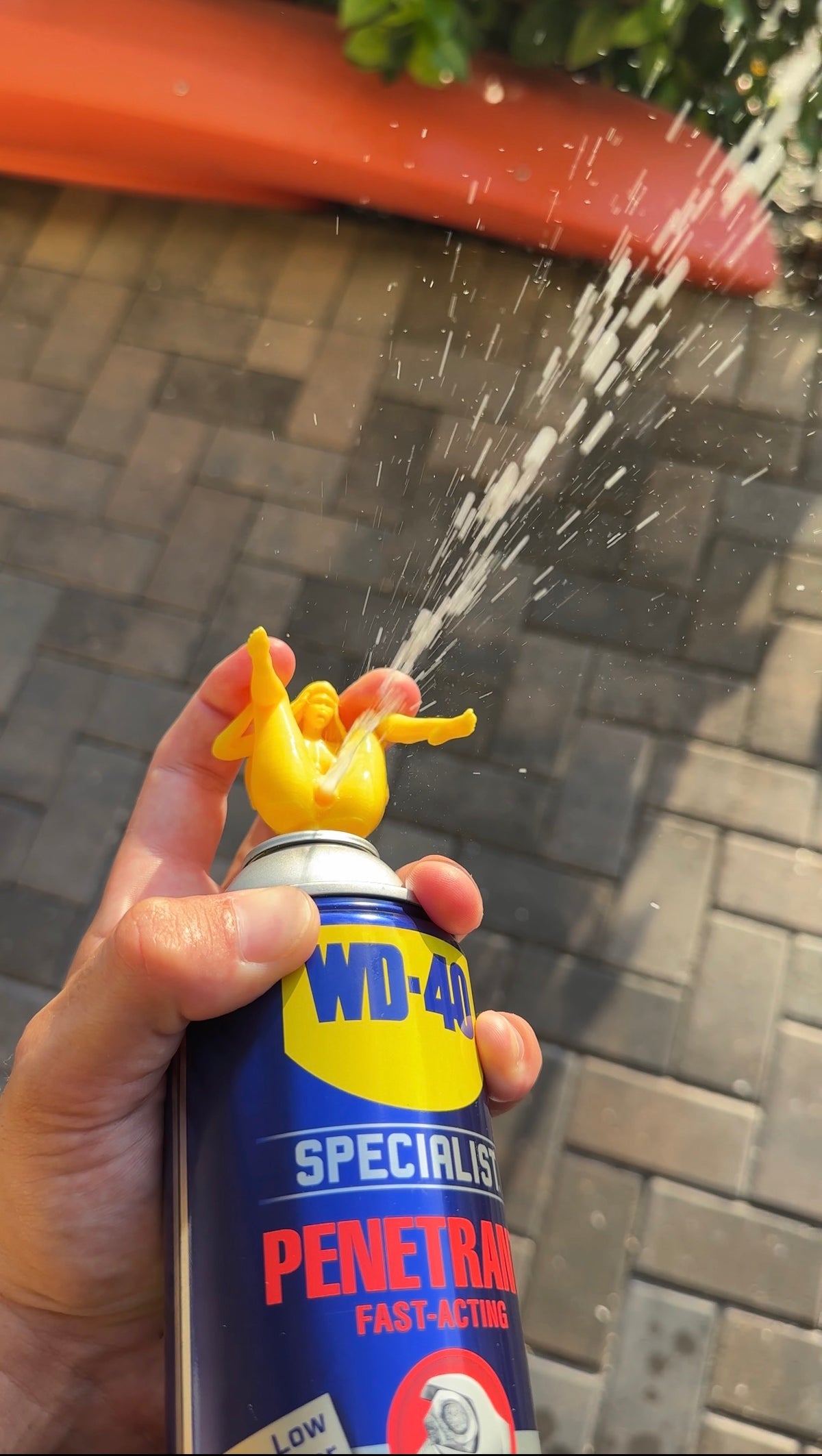 Naughty Top installed on a WD-40 can and spraying