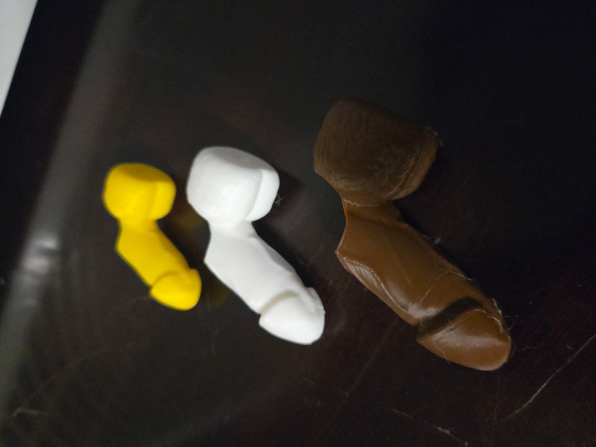 Side view of the Spray Daddy Trio: small yellow, medium white and large brown spray tops